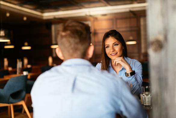 Two business people having an informal meeting in a cafe